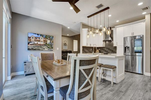 Dining room, Interior, Kitchen, Pendant Lights, Recessed Lighting, Stainless Steel Appliances, Wood Texture Flooring