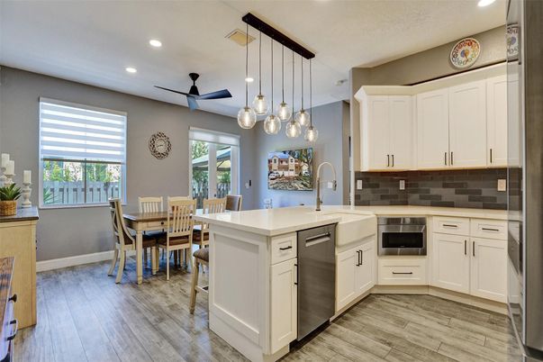 Dining room, Interior, Kitchen, Pendant Lights, Recessed Lighting, Stainless Steel Appliances, Wood Texture Flooring