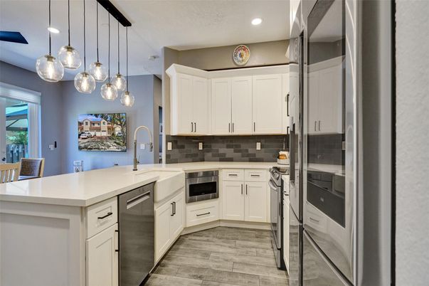 Interior, Kitchen, Pendant Lights, Recessed Lighting, Stainless Steel Appliances, Wood Texture Flooring