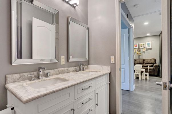 Bathroom, Dual Sink Vanities, Interior, Recessed Lighting, Wood Texture Flooring
