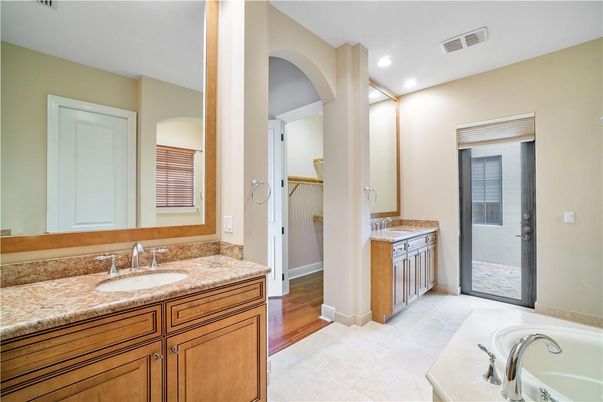 Bathroom, Dual Sink Vanities, Interior, Recessed Lighting, Wood Texture Flooring