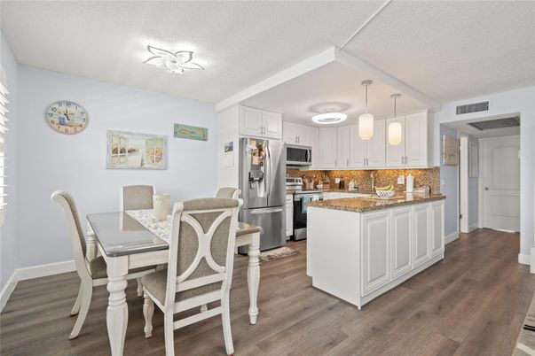 Dining room, Interior, Kitchen, Pendant Lights, Stainless Steel Appliances, Wood Texture Flooring