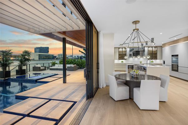 Dining room, Interior, Kitchen, Pendant Lights, Recessed Lighting, Stainless Steel Appliances, Water, Wood Texture Flooring