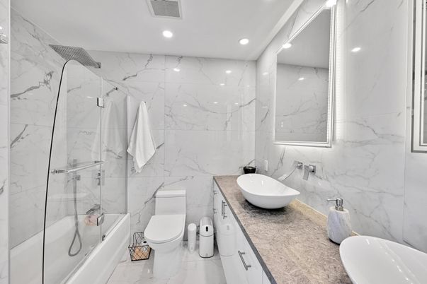 Bathroom, Dual Sink Vanities, Glass Shower, Interior, Marble, Marble Walls, Recessed Lighting