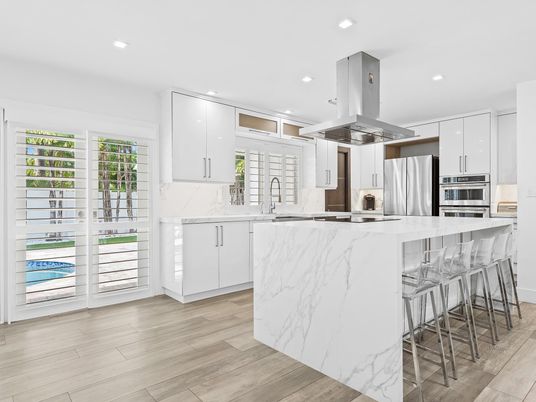 Interior, Kitchen, Marble Walls, Recessed Lighting, Stainless Steel Appliances, Wood Texture Flooring