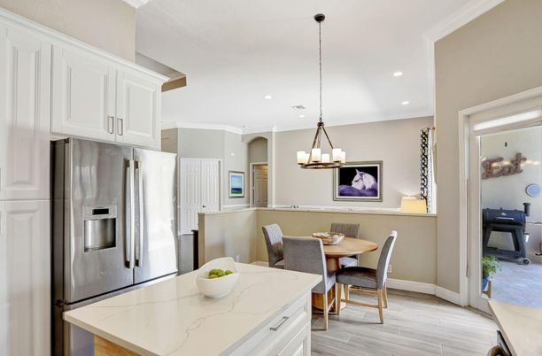Chandelier, Dining room, Interior, Kitchen, Recessed Lighting, Stainless Steel Appliances, Wood Texture Flooring