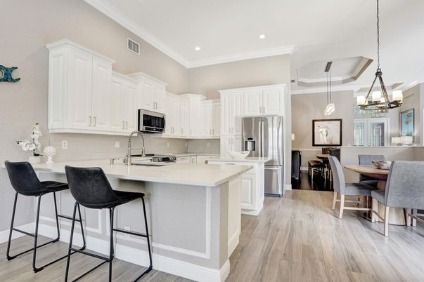 Chandelier, Dining room, Interior, Kitchen, Pendant Lights, Recessed Lighting, Stainless Steel Appliances, Wood Texture Flooring