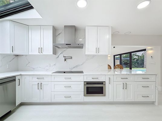 Interior, Kitchen, Marble Walls, Recessed Lighting, Stainless Steel Appliances