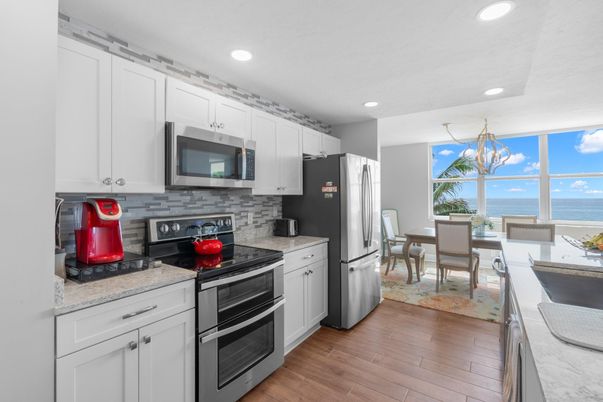 Dining room, Interior, Kitchen, Recessed Lighting, Stainless Steel Appliances, Water, Wood Texture Flooring