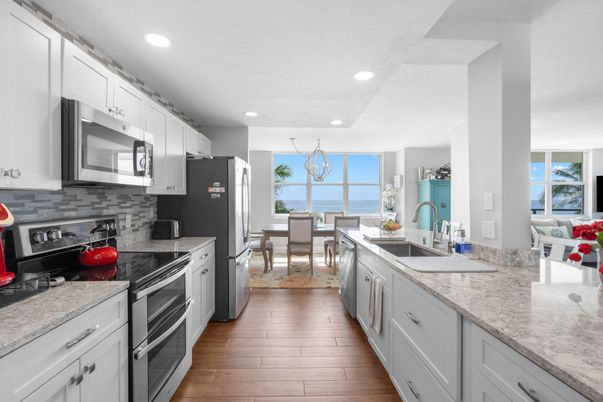 Chandelier, Dining room, Interior, Kitchen, Recessed Lighting, Stainless Steel Appliances, Water, Wood Texture Flooring