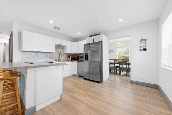 Dining room, Interior, Kitchen, Recessed Lighting, Stainless Steel Appliances, Wood Texture Flooring