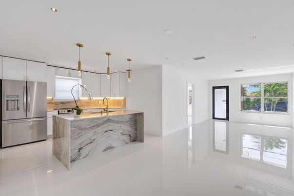 Interior, Kitchen, Marble Walls, Pendant Lights, Recessed Lighting, Stainless Steel Appliances