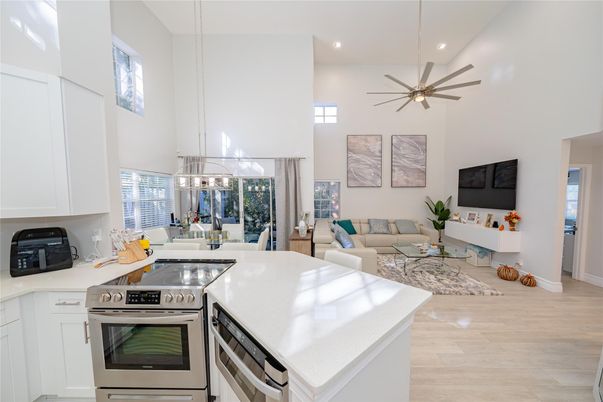 Dining room, Interior, Kitchen, Living room, Pendant Lights, Recessed Lighting, Stainless Steel Appliances, Wood Texture Flooring
