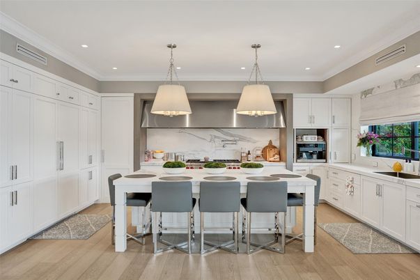Interior, Kitchen, Marble Walls, Pendant Lights, Recessed Lighting, Stainless Steel Appliances, Wood Texture Flooring