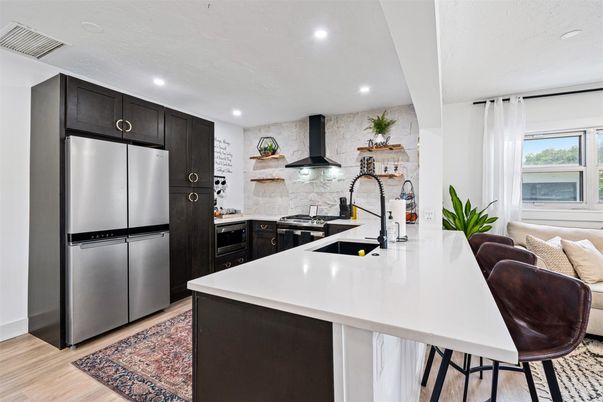 Interior, Kitchen, Recessed Lighting, Stainless Steel Appliances, Stone Walls, Wood Texture Flooring