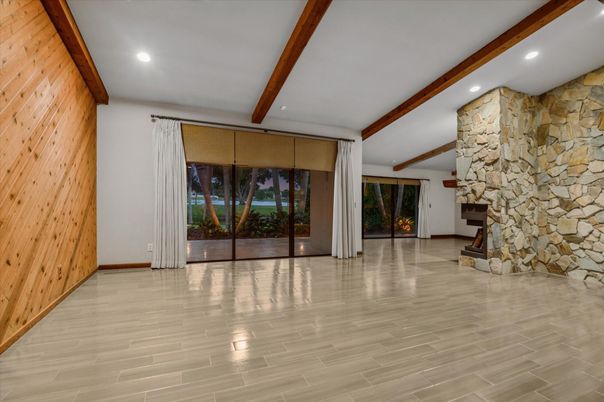 Empty room, Fireplace, Interior, Recessed Lighting, Stone Walls, Wooden Beams, Wood Texture Flooring