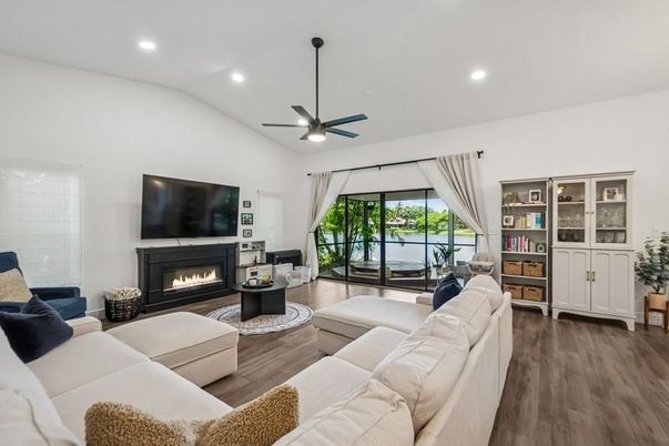 Fireplace, Interior, Living room, Recessed Lighting, Water, Wood Texture Flooring