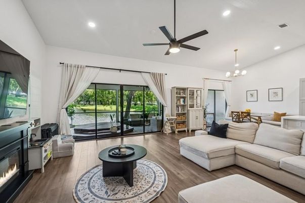 Chandelier, Dining room, Fireplace, Interior, Living room, Recessed Lighting, Wood Texture Flooring