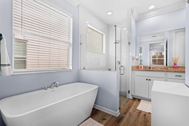 Bathroom, Free Standing Baths, Glass Shower, Interior, Recessed Lighting, Wood Texture Flooring