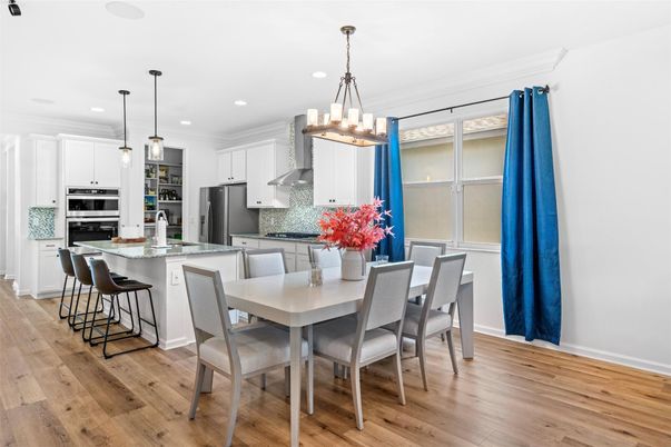 Chandelier, Dining room, Interior, Kitchen, Pendant Lights, Recessed Lighting, Stainless Steel Appliances, Wood Texture Flooring