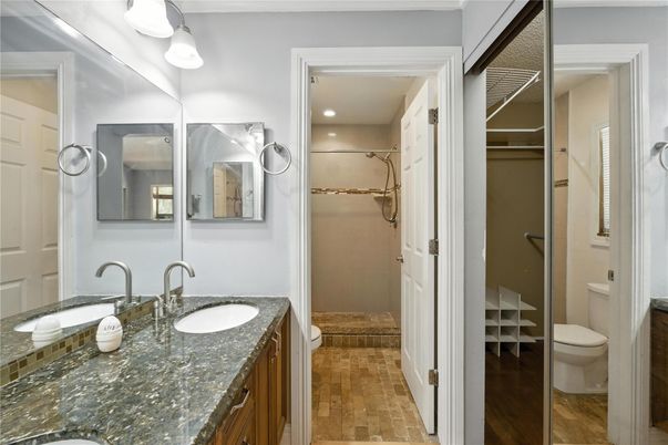 Bathroom, Dual Sink Vanities, Glass Shower, Interior, Recessed Lighting, Walk-in Closets, Wood Texture Flooring