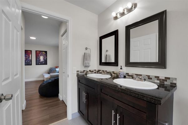 Bathroom, Dual Sink Vanities, Interior, Recessed Lighting, Wood Texture Flooring