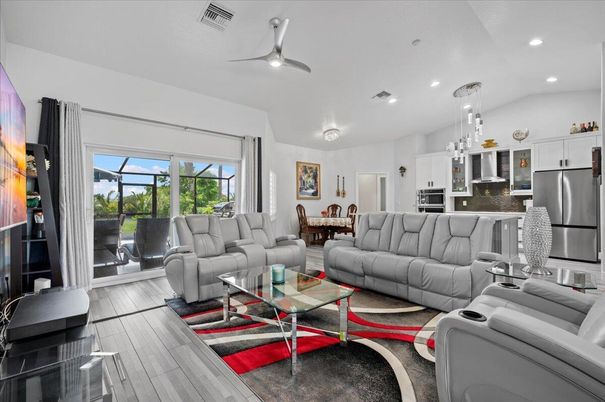 Dining room, Interior, Kitchen, Living room, Pendant Lights, Recessed Lighting, Stainless Steel Appliances, Wood Texture Flooring
