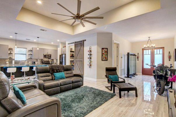 Chandelier, Dining room, Interior, Kitchen, Living room, Pendant Lights, Recessed Lighting, Stainless Steel Appliances, Wood Texture Flooring
