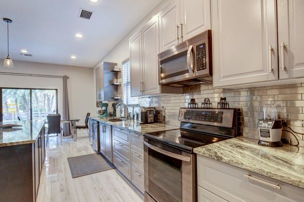 Dining room, Interior, Kitchen, Pendant Lights, Recessed Lighting, Stainless Steel Appliances, Wood Texture Flooring
