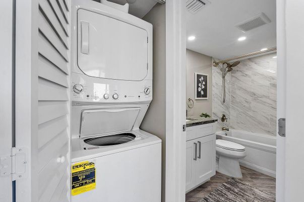 Bathroom, Interior, Marble Walls, Recessed Lighting, Utility Closets, Washer, Wood Texture Flooring