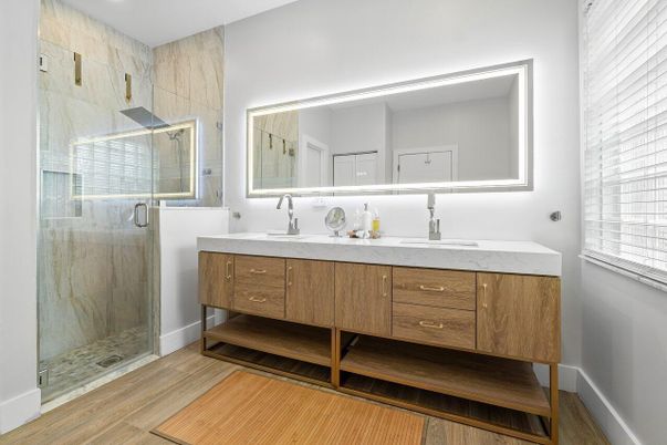Bathroom, Dual Sink Vanities, Glass Shower, Interior, Recessed Lighting, Wood Texture Flooring