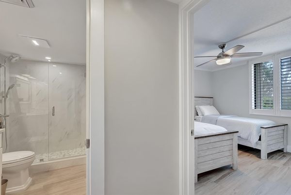 Bathroom, Bedroom, Glass Shower, Interior, Marble Walls, Recessed Lighting, Wood Texture Flooring
