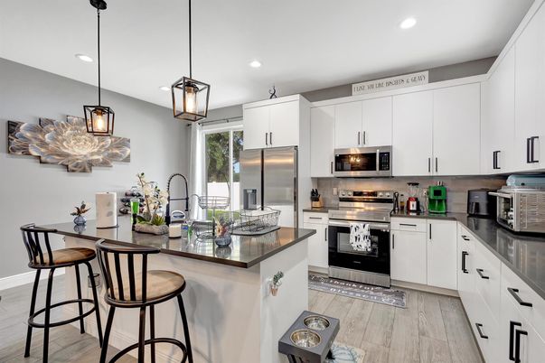 Interior, Kitchen, Pendant Lights, Recessed Lighting, Stainless Steel Appliances, Wood Texture Flooring