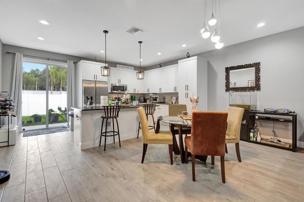 Dining room, Interior, Kitchen, Pendant Lights, Recessed Lighting, Stainless Steel Appliances, Wood Texture Flooring
