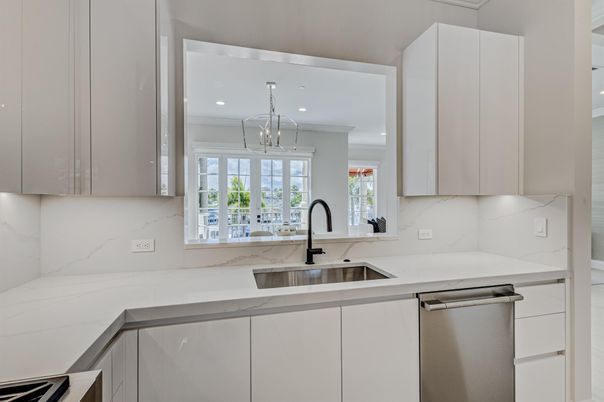 Interior, Kitchen, Marble Walls, Pendant Lights, Recessed Lighting, Stainless Steel Appliances
