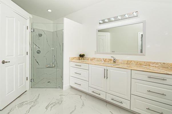 Bathroom, Dual Sink Vanities, Glass Shower, Interior, Marble, Marble Walls, Recessed Lighting