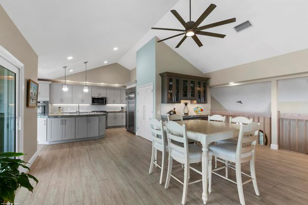 Dining room, Interior, Kitchen, Pendant Lights, Recessed Lighting, Stainless Steel Appliances, Wood Texture Flooring
