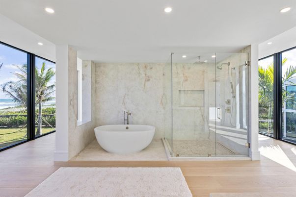 Bathroom, Free Standing Baths, Glass Shower, Interior, Marble Walls, Recessed Lighting, Wood Texture Flooring