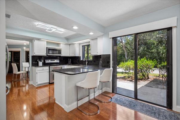 Dining room, Interior, Kitchen, Recessed Lighting, Stainless Steel Appliances, Wood Texture Flooring