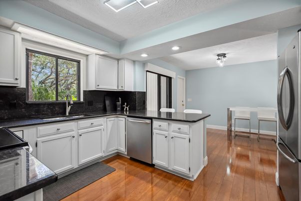 Dining room, Interior, Kitchen, Recessed Lighting, Stainless Steel Appliances, Wood Texture Flooring
