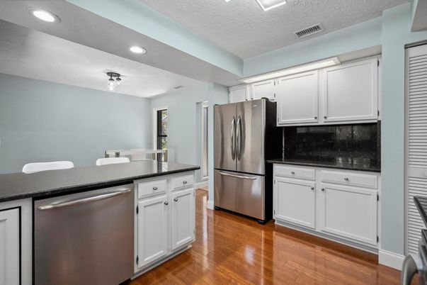 Dining room, Interior, Kitchen, Recessed Lighting, Stainless Steel Appliances, Wood Texture Flooring