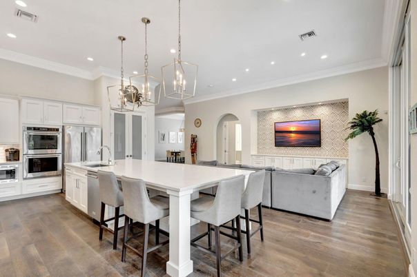 Chandelier, Dining room, Interior, Kitchen, Living room, Pendant Lights, Recessed Lighting, Stainless Steel Appliances, Wood Texture Flooring