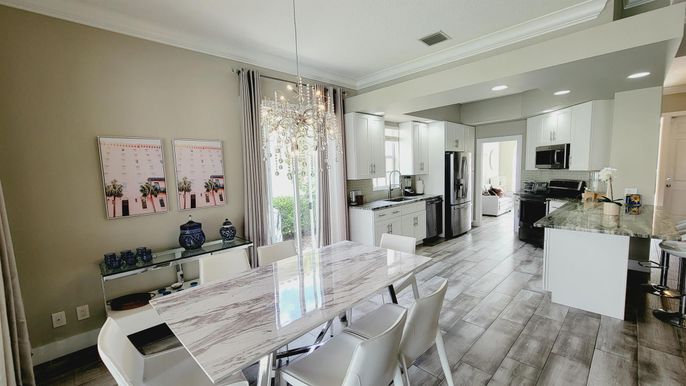 Dining room, Interior, Kitchen, Pendant Lights, Recessed Lighting, Stainless Steel Appliances, Wood Texture Flooring