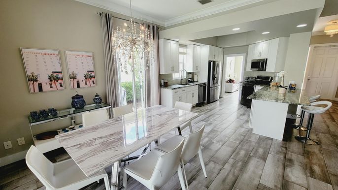 Dining room, Interior, Kitchen, Pendant Lights, Recessed Lighting, Stainless Steel Appliances, Wood Texture Flooring