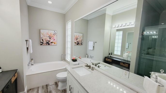 Bathroom, Dual Sink Vanities, Glass Shower, Interior, Recessed Lighting, Wood Texture Flooring