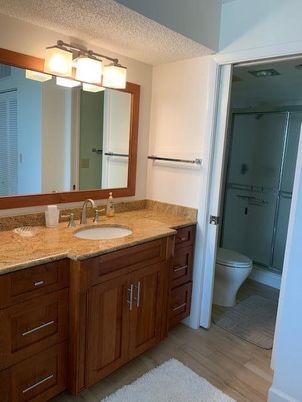 Bathroom, Dual Sink Vanities, Glass Shower, Interior, Wood Texture Flooring
