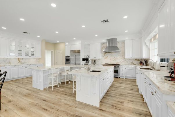 Interior, Kitchen, Marble Walls, Recessed Lighting, Stainless Steel Appliances, Wood Texture Flooring