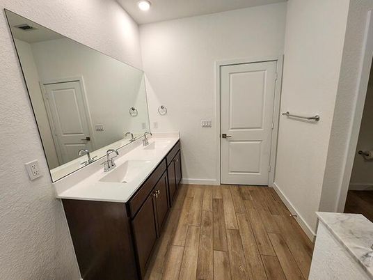 Bathroom, Dual Sink Vanities, Interior, Recessed Lighting, Wood Texture Flooring