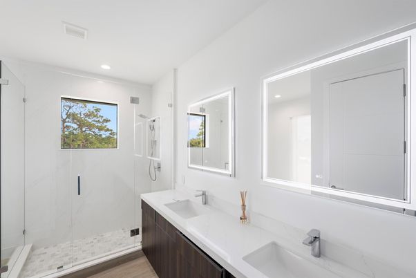 Bathroom, Dual Sink Vanities, Glass Shower, Interior, Marble Walls, Recessed Lighting, Wood Texture Flooring