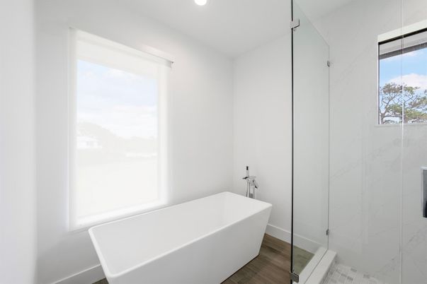 Bathroom, Free Standing Baths, Glass Shower, Interior, Marble Walls, Recessed Lighting, Wood Texture Flooring